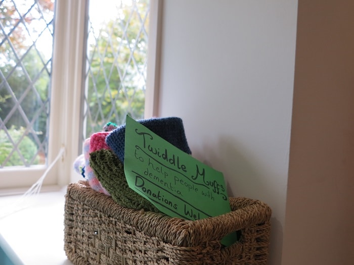 Twiddle muffs for people living with dementia, crafted by the local knitting group that meets in the hospice