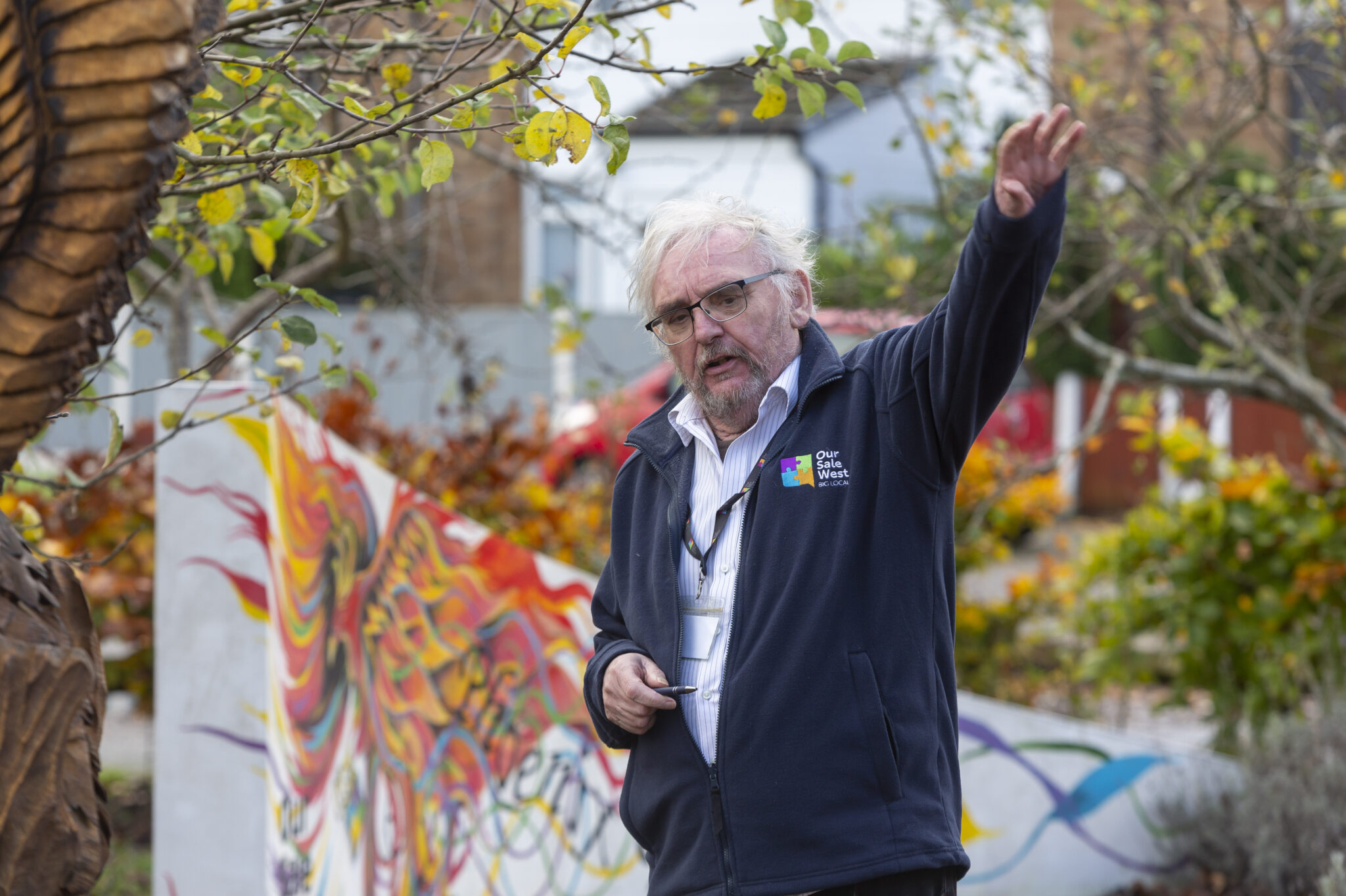Co-chair Ralph Rudden leads a tour of Sale West’s community green spaces at the Big Local climate residential.