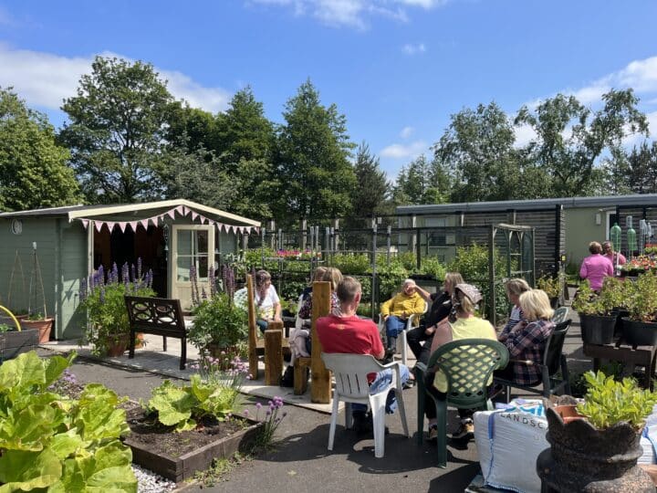 Community members meet in a community run garden