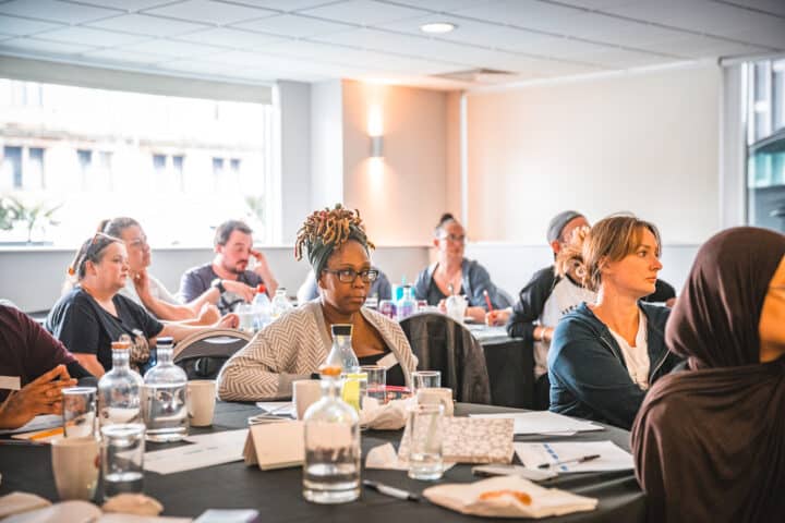 A group of adults sitting at an event